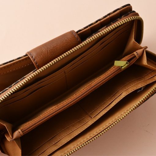 Madison zip clutch 2025 fossil